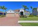 Beautiful two-story home with three-car garage and landscaped yard at 5522 69Th E Pl, Ellenton, FL 34222
