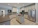 Gourmet kitchen with island, stainless steel appliances and light cabinets at 5522 69Th E Pl, Ellenton, FL 34222