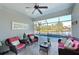 Covered lanai with comfortable seating overlooking the pool at 5522 69Th E Pl, Ellenton, FL 34222