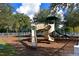 Community playground with slides, climbing structures, and swings at 5522 69Th E Pl, Ellenton, FL 34222