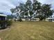 Community featuring several yellow houses and lush landscaping at 5931 Tidewood Ave # 8, Sarasota, FL 34231