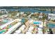 Aerial perspective of community near the water with tennis courts and pool at 6005 Midnight Pass Rd # N8, Sarasota, FL 34242