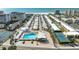 Aerial view of coastal community, featuring pool, tennis courts, and beach access at 6005 Midnight Pass Rd # N8, Sarasota, FL 34242