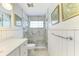 Bathroom with a walk-in shower and white vanity at 6005 Midnight Pass Rd # N8, Sarasota, FL 34242