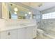 Elegant bathroom with a walk-in shower and white cabinetry at 6005 Midnight Pass Rd # N8, Sarasota, FL 34242