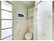 Simple bathroom with shower and toilet at 6005 Midnight Pass Rd # N8, Sarasota, FL 34242