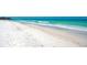 Scenic beach view with clear water and white sand at 6005 Midnight Pass Rd # N8, Sarasota, FL 34242