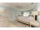 Bright bedroom with a queen bed and built-in wardrobe at 6005 Midnight Pass Rd # N8, Sarasota, FL 34242