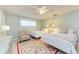 Charming bedroom with two twin beds, and a sitting area at 6005 Midnight Pass Rd # N8, Sarasota, FL 34242
