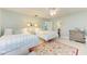 Light and airy bedroom with two twin beds, and a sitting area at 6005 Midnight Pass Rd # N8, Sarasota, FL 34242