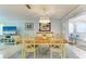 Bright dining room with a table for six and a chandelier at 6005 Midnight Pass Rd # N8, Sarasota, FL 34242