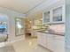 Modern kitchen with white cabinets and granite countertops at 6005 Midnight Pass Rd # N8, Sarasota, FL 34242