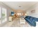 Bright and airy living room with ample seating and large windows at 6005 Midnight Pass Rd # N8, Sarasota, FL 34242