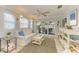 Bright living room features a comfy sofa, coffee table, and access to a private patio at 6005 Midnight Pass Rd # N8, Sarasota, FL 34242