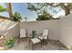 Private patio with comfortable seating for relaxing outdoors at 6005 Midnight Pass Rd # N8, Sarasota, FL 34242