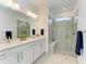 Modern bathroom with double vanity and large walk-in shower at 6273 Winding Pine Dr, Nokomis, FL 34275