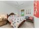 Charming bedroom with nautical-themed bedding and decor at 6273 Winding Pine Dr, Nokomis, FL 34275