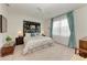 Spacious bedroom with large window and ceiling fan at 6273 Winding Pine Dr, Nokomis, FL 34275
