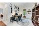 Home office with granite desk and built-in shelving at 6273 Winding Pine Dr, Nokomis, FL 34275