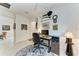 Home office featuring a desk and decorative wall accents at 6273 Winding Pine Dr, Nokomis, FL 34275