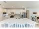 Modern kitchen with white cabinets, large island, and stainless steel appliances at 6273 Winding Pine Dr, Nokomis, FL 34275