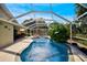 Inviting screened pool area with lounge chairs and lush landscaping at 6607 39Th Avenue W Cir, Bradenton, FL 34209