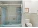 Light teal bathroom with shower/tub combo and updated vanity at 7056 Hawks Harbor Cir, Bradenton, FL 34207