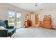 Bedroom with French doors to balcony and wood dresser at 7056 Hawks Harbor Cir, Bradenton, FL 34207