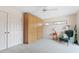 Bedroom with built-in wardrobe and comfortable armchair at 7056 Hawks Harbor Cir, Bradenton, FL 34207