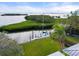 Private dock with sailboat and paddleboard at 7056 Hawks Harbor Cir, Bradenton, FL 34207