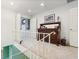 Upper hallway with built-in shelving and antique dresser at 7056 Hawks Harbor Cir, Bradenton, FL 34207