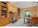 Home office with fireplace and built-in bookcases at 7056 Hawks Harbor Cir, Bradenton, FL 34207