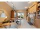 Home office with fireplace, built-ins, and backyard access at 7056 Hawks Harbor Cir, Bradenton, FL 34207