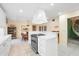 Modern kitchen with white cabinets, stainless steel appliances, and a large island at 7056 Hawks Harbor Cir, Bradenton, FL 34207