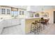 Bright white kitchen with stainless steel appliances and granite countertops at 7056 Hawks Harbor Cir, Bradenton, FL 34207