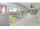 Spacious screened balcony overlooking the water with seating at 7056 Hawks Harbor Cir, Bradenton, FL 34207