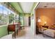 Sunroom with built-in cabinetry and access to hallway at 7056 Hawks Harbor Cir, Bradenton, FL 34207