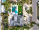 Aerial view showing house, pool, and lush landscaping at 711 Russell St, Longboat Key, FL 34228