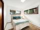 Cozy bedroom with a full-size bed and teal accents at 711 Russell St, Longboat Key, FL 34228