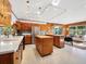 Mid-century modern kitchen with wood cabinets and an island at 711 Russell St, Longboat Key, FL 34228