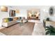 Spacious living room with sectional sofa and view into bedroom at 711 Russell St, Longboat Key, FL 34228