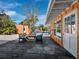 Outdoor patio with dining table and chairs, near the pool at 711 Russell St, Longboat Key, FL 34228