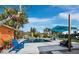 Inviting pool area with lounge chairs and umbrella at 711 Russell St, Longboat Key, FL 34228