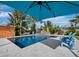 Underneath umbrella view of pool and patio area at 711 Russell St, Longboat Key, FL 34228