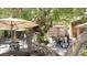 Outdoor patio seating under large trees at 711 Russell St, Longboat Key, FL 34228