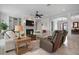 Bright living room featuring a fireplace, built-in shelves and comfortable seating at 718 Key Royale Dr, Holmes Beach, FL 34217