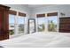 Bright main bedroom with large windows offering scenic views and comfortable furniture at 718 Key Royale Dr, Holmes Beach, FL 34217