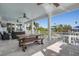 Spacious porch with dining table overlooking waterfront at 718 Key Royale Dr, Holmes Beach, FL 34217