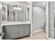Elegant bathroom with double vanity, large mirror, and modern fixtures at 7946 Tybee Ct, University Park, FL 34201