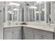 Modern bathroom with corner double vanity and bright lighting at 7946 Tybee Ct, University Park, FL 34201